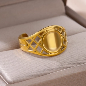 Macro view of gold snake style ring with hollow geometric texture on jewelry box