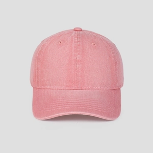 Close-up of pink washed cotton baseball cap showing vintage texture and stitching