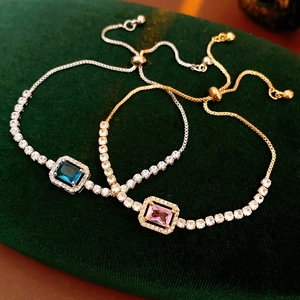 Macro detail of adjustable drawstring bracelets with rectangle blue and pink zircon stones