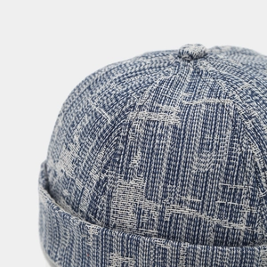 Close-up of blue and white jacquard denim docker hat showing detailed woven texture