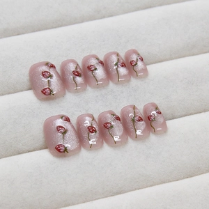 Pink cat eye handmade press-on nails with sweet strawberry design and 3D glitter effect
