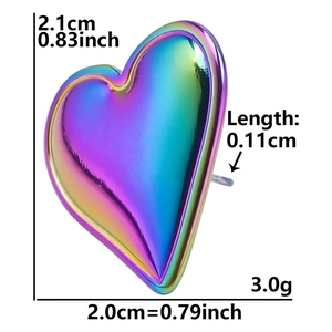 Macro view of heart-shaped iridescent steel earring with size labels and measurements