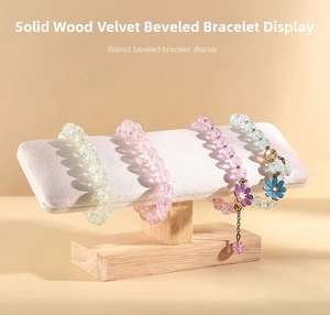 Solid wood bracelet display stand with beige velvet support showing beaded jewelry
