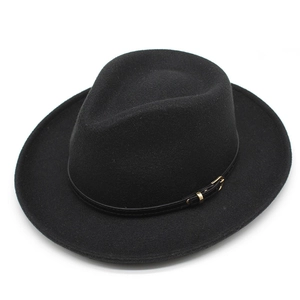 Detail of black wool felt fedora featuring a slim leather band with a gold metal buckle