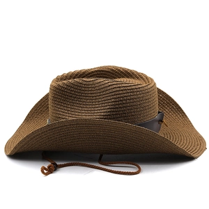 Detail of dark brown woven cowboy hat featuring a leather band and adjustable chin cord