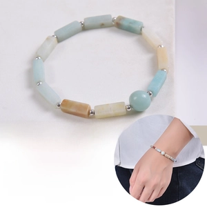 Detail of rectangular and round natural crystal beads with silver spacer accents