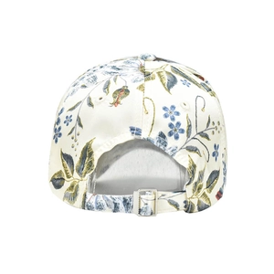 Detail of adjustable metal buckle and floral embroidery on beige baseball cap