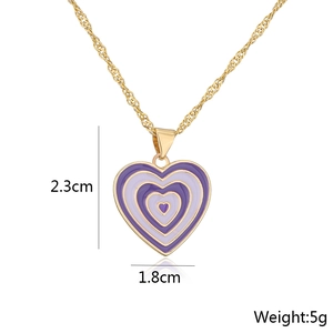Detail view of purple enamel heart pendant with 2.3cm x 1.8cm size and 5g weight info