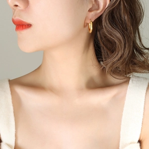 Classic gold geometric C-shaped hoop earrings for women with minimalist tubular design