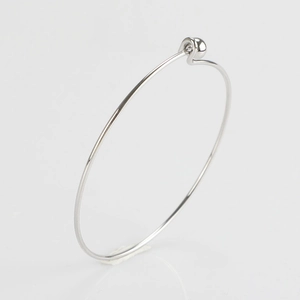 Detailed side view of 1.5mm stainless steel bangle featuring a screw-off ball clasp