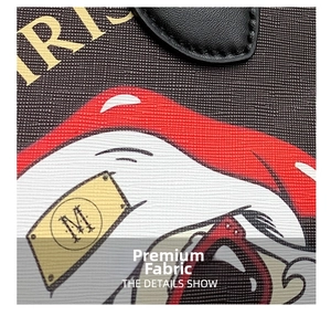 Detailed close-up of Saffiano texture fabric with Santa print and gold M PARIS emblem