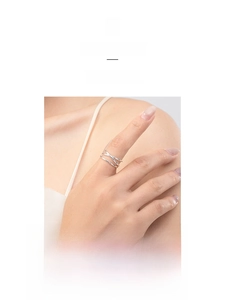 Detail view of S925 sterling silver geometric crisscross ring on a finger
