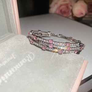 Silver layered bangle with pink cubic zirconia crystals on pink velvet jewelry box