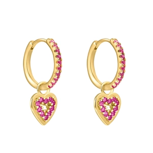 Close-up of gold hoop earrings with pink zircons and heart charms on white background
