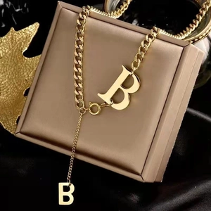 Gold-plated chunky chain necklace featuring dual B-letter pendants in a minimalist design