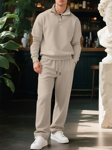 Detail of men's beige knit set featuring ribbed texture and stylish elbow patches