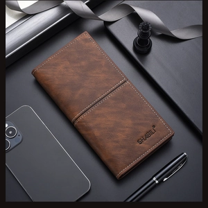 Close-up of vintage brown slim long wallet featuring white contrast stitching details