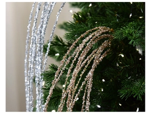 Close-up of glitter sequins on gold and silver Christmas branches for tree decoration