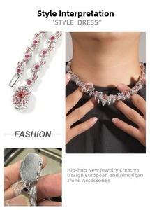 Detail of hip-hop necklace with red eye crystals and silver thorn-like spikes design