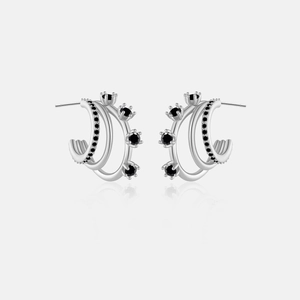 Detail of 925 sterling silver triple-layer C-shape hoop earrings with black gemstones