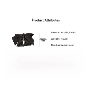 Detail of black fabric bow hair claw clip showing 4cm size and 46g weight specs