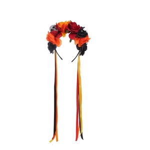 Detail of Halloween floral headband with skull, vibrant roses and long satin ribbons