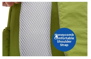Close-up of breathable honeycomb mesh shoulder straps on green travel backpack