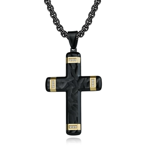 Two-tone cross pendant necklace in black carbon fiber texture with gold accents and gems