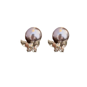 Elegant gold plated bow earrings with white pearl and sparkling zircon crystals