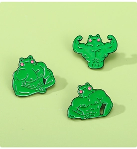 Detailed view of funny muscle frog enamel pins set showing athletic poses on green background