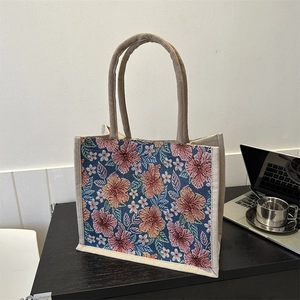 Fashionable floral jacquard tote bag with woven flower patterns and cream canvas handles