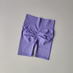 Detail view of high waist lavender seamless scrunch butt shorts with ribbed waistband