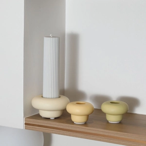 Modern ceramic candle holder set in beige, yellow, and moss green for home table decor