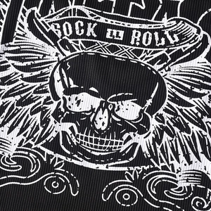Detail of Rock N Roll skull print on black ribbed knit fabric of a cropped tee