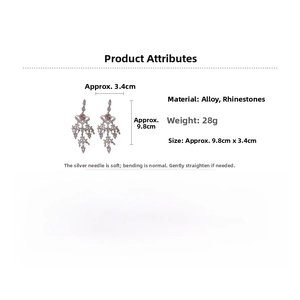 Detailed view showing sparkling rhinestone heart tassel earrings with silver needle posts