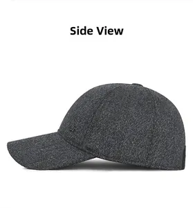 Detailed side view showing wool-like texture and lion metal logo on a grey baseball cap