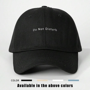 Adjustable black cotton baseball cap with white Do Not Disturb embroidery and curved brim