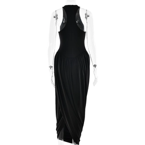Detail view of the black backless dress featuring a sleeveless design and draped back silhouette