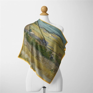Detail of silk scarf with Van Gogh wheat field oil painting on a white mannequin