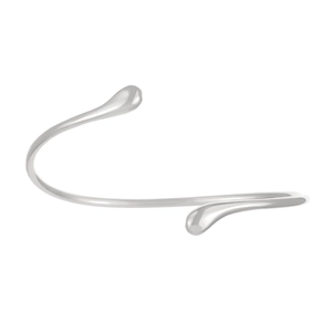 Macro view of a silver liquid metal arm cuff with a sleek polished finish and open design
