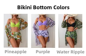 Detail view of three-piece bikini sets with pineapple, tiger, and wave print cover-ups
