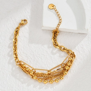 Detail of 18K gold stainless steel multi-layered chain bracelet with paperclip links