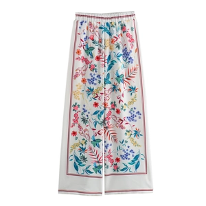 Women's resort style floral print wide leg trousers with vibrant botanical pattern