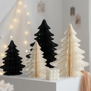 Minimalist origami paper Christmas tree ornaments in black and beige honeycomb design