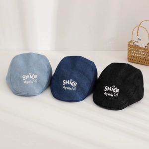 Detailed embroidery of SMICE smile text on denim beret hats in blue and black colors