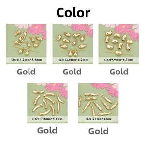Macro view of 18k gold plated drop and tube charms for DIY jewelry making