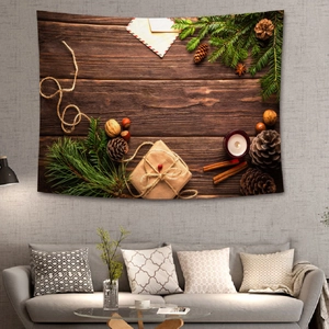 Christmas tapestry with pine cones and gift boxes hanging on a cozy living room wall