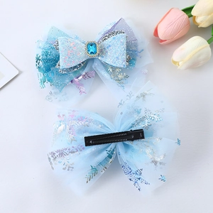 Pair of blue tulle bow hair clips with silver snowflake sequins and crystal for girls