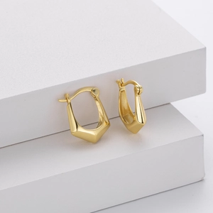 Minimalist S925 sterling silver geometric hoop earrings in gold on white steps
