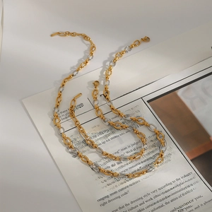 Chic layered two-tone titanium steel necklace with interlocking oval gold and silver links